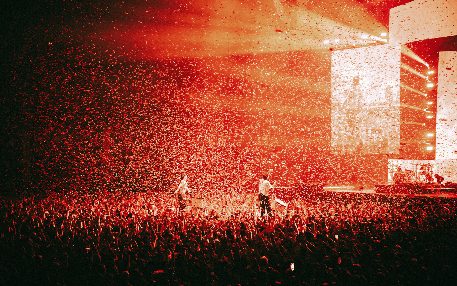 Twenty One Pilots performing in OVO Hydro surrounded by red confetti