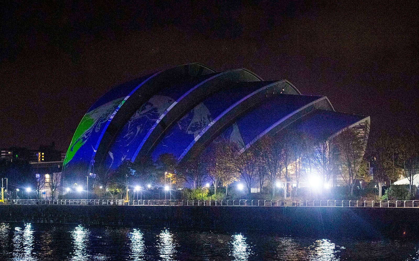 View of the SEC Armadillo from the River Clyde with the snippets of the globe projected on it.