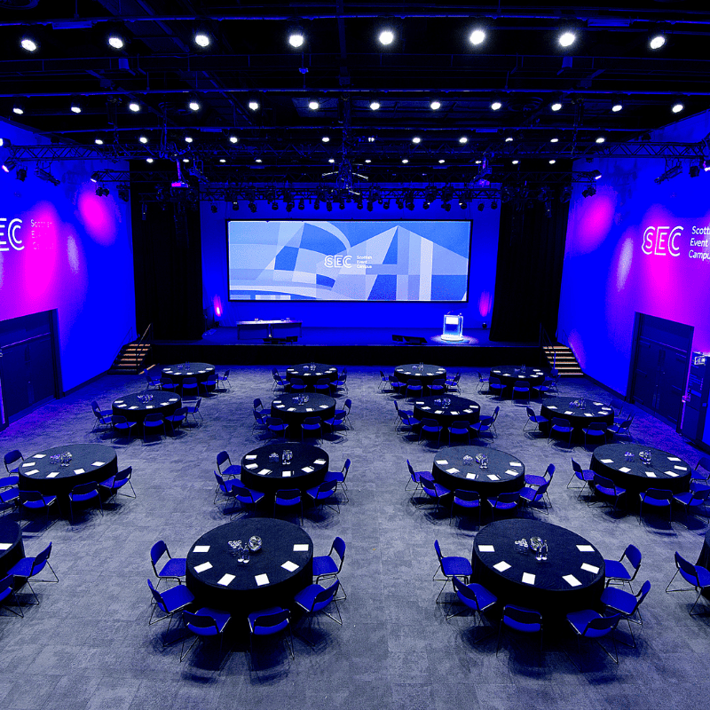 Lomond Auditorium with cabaret seating laid out and a projection screen on stage