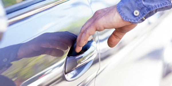 Someone opening a car door.