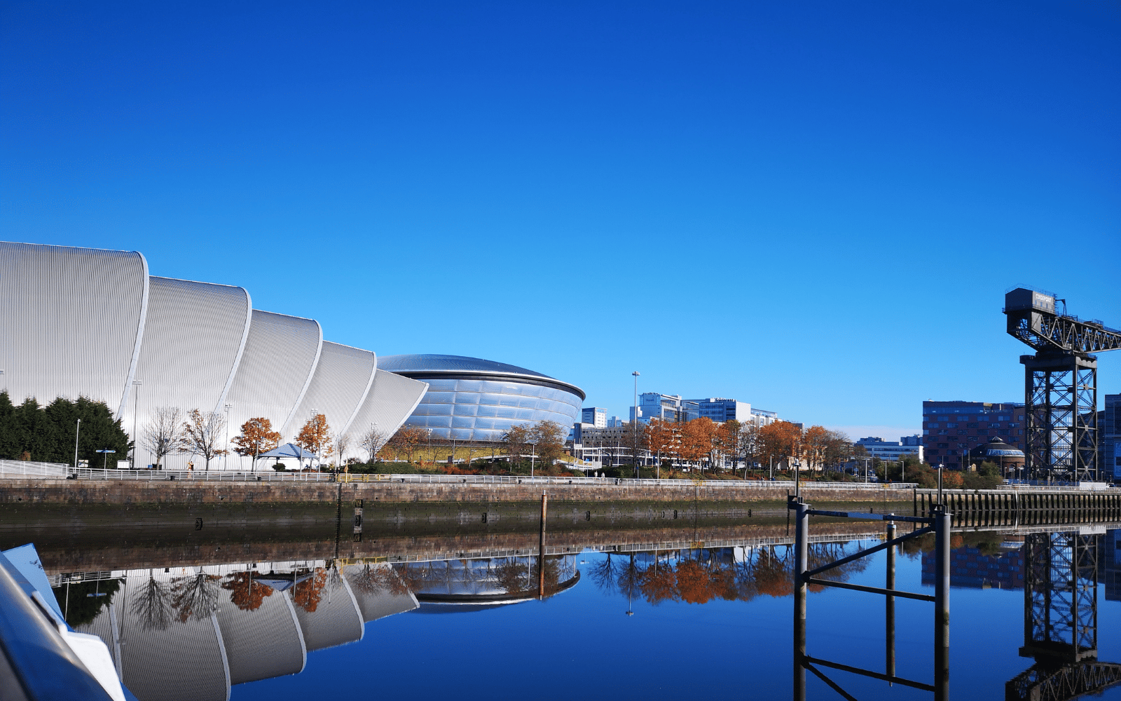 view of SEC campus featuring the SEC armadillo and OVO Hydro from across the River Clyde on a clear day