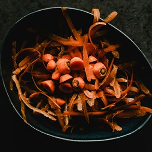 A pot of carrot peelings.