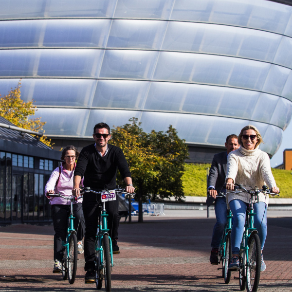 People cycling at the Scottish Event Campus.