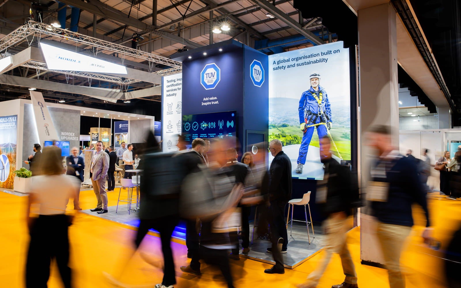 People walking around an exhibition.